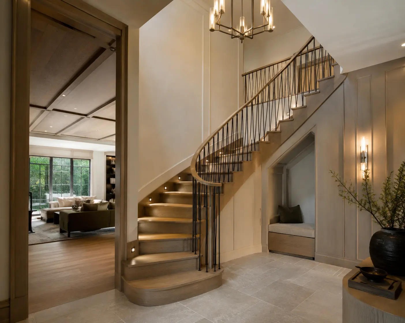 Oak staircase with slim dark metal railings and integrated wall lighting